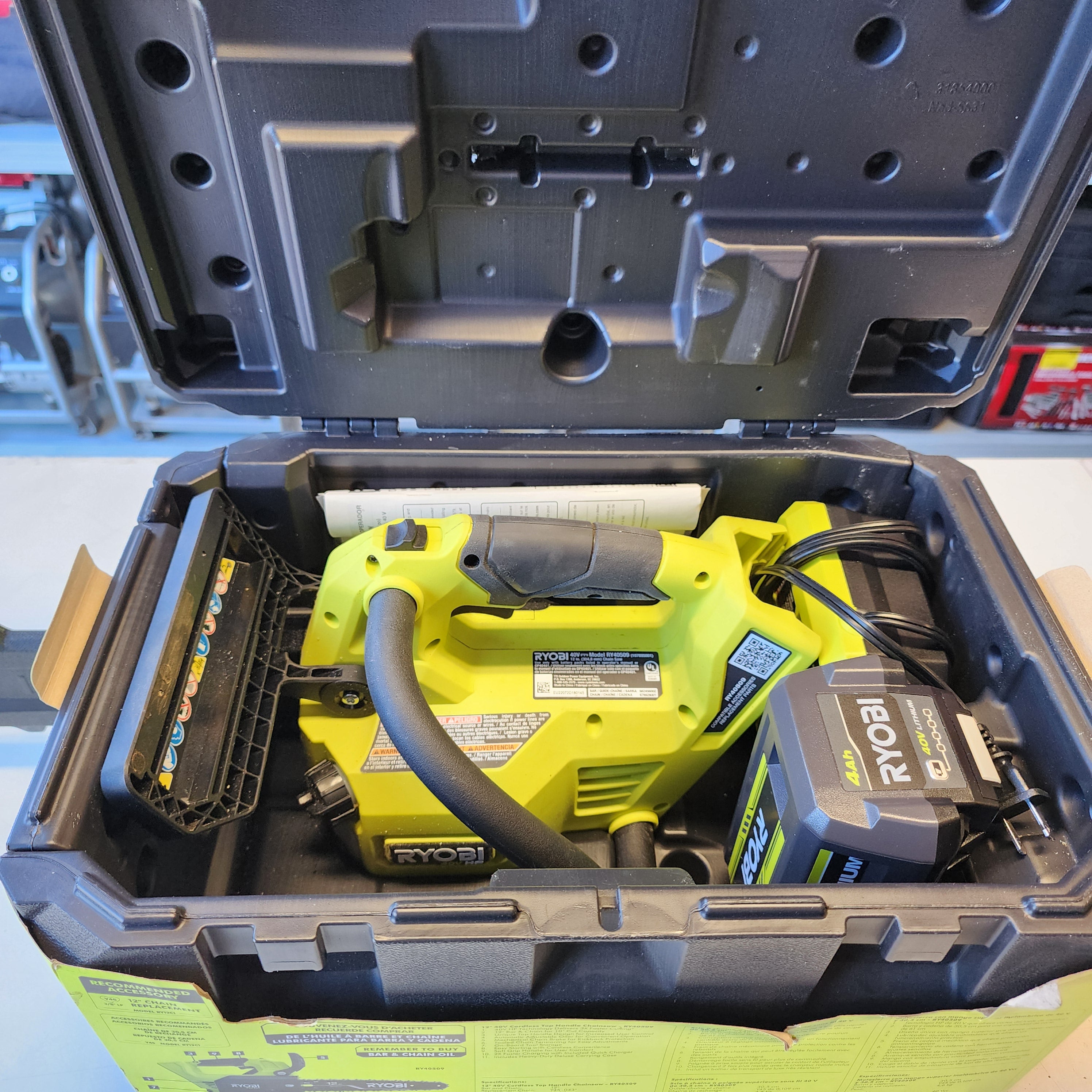 RYOBI 40V HP Brushless 12 in. Top Handle Battery Chainsaw with 4.0 Ah Battery and Charger RYOBI