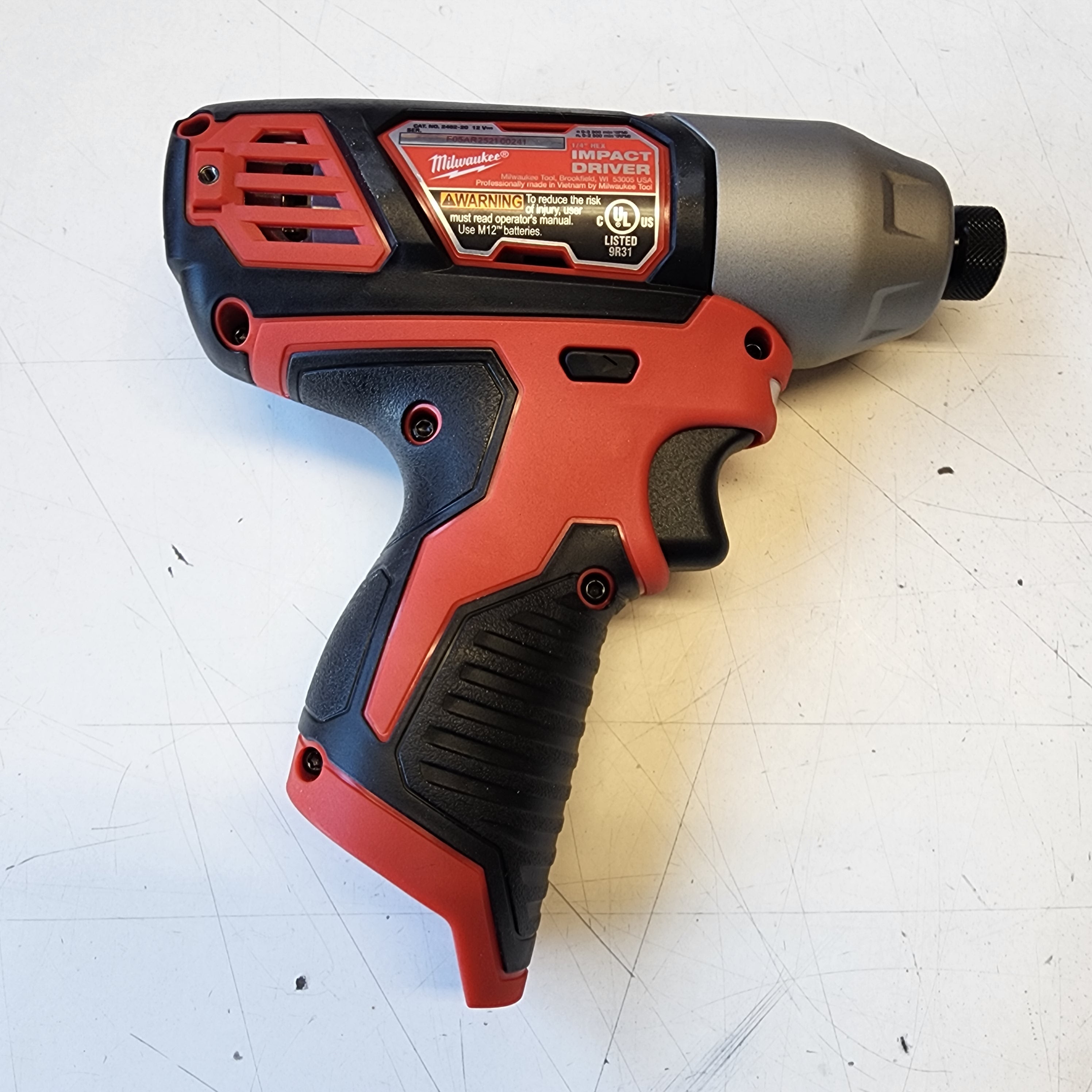 compact Milwaukee impact driver close up view